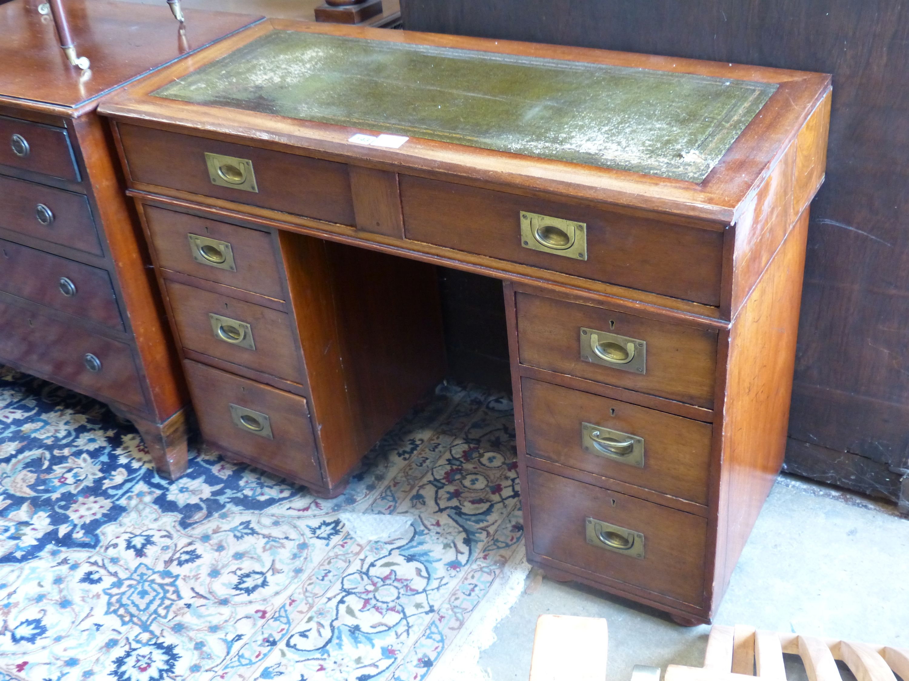 A small mahogany military style pedestal desk, length 99cm, width 42cm, height 73cm